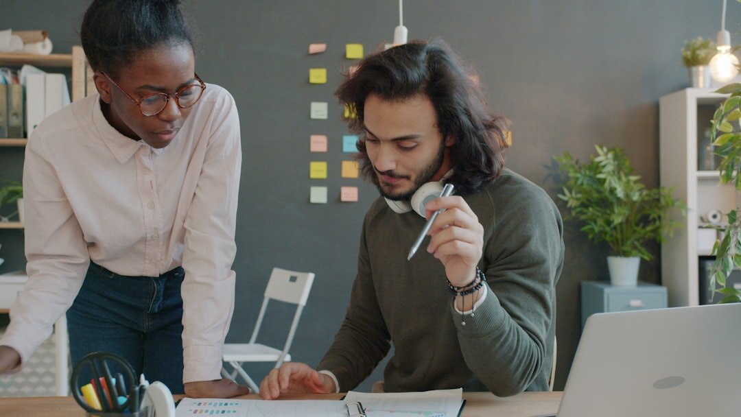 Diverse team of media professionals collaborating in modern office